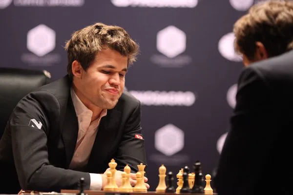 Magnus Carlsen at the board opposite Sergey Karjakin during game 12 of the 2016 World Championship.